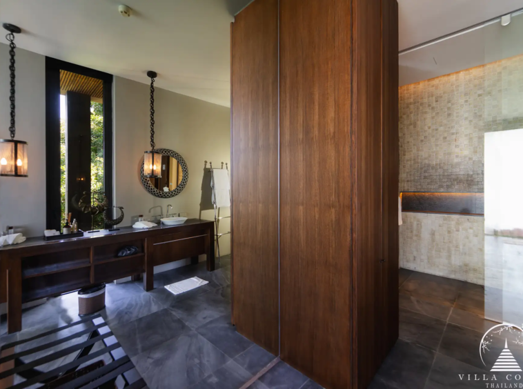 Elegant master bathroom in Villa Amarisa with a Moroccan-tiled shower and double vanity.