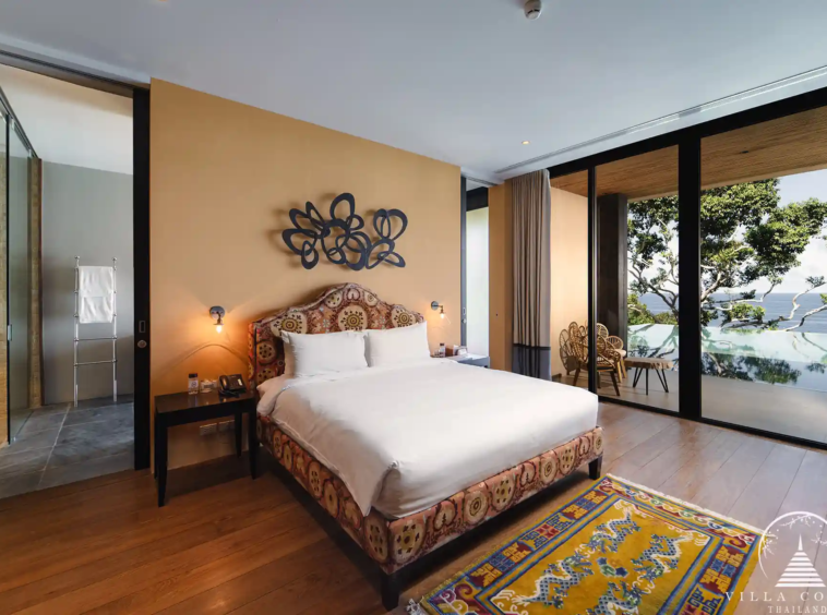 Master bedroom at Villa Amarisa with panoramic sea views and a private balcony.