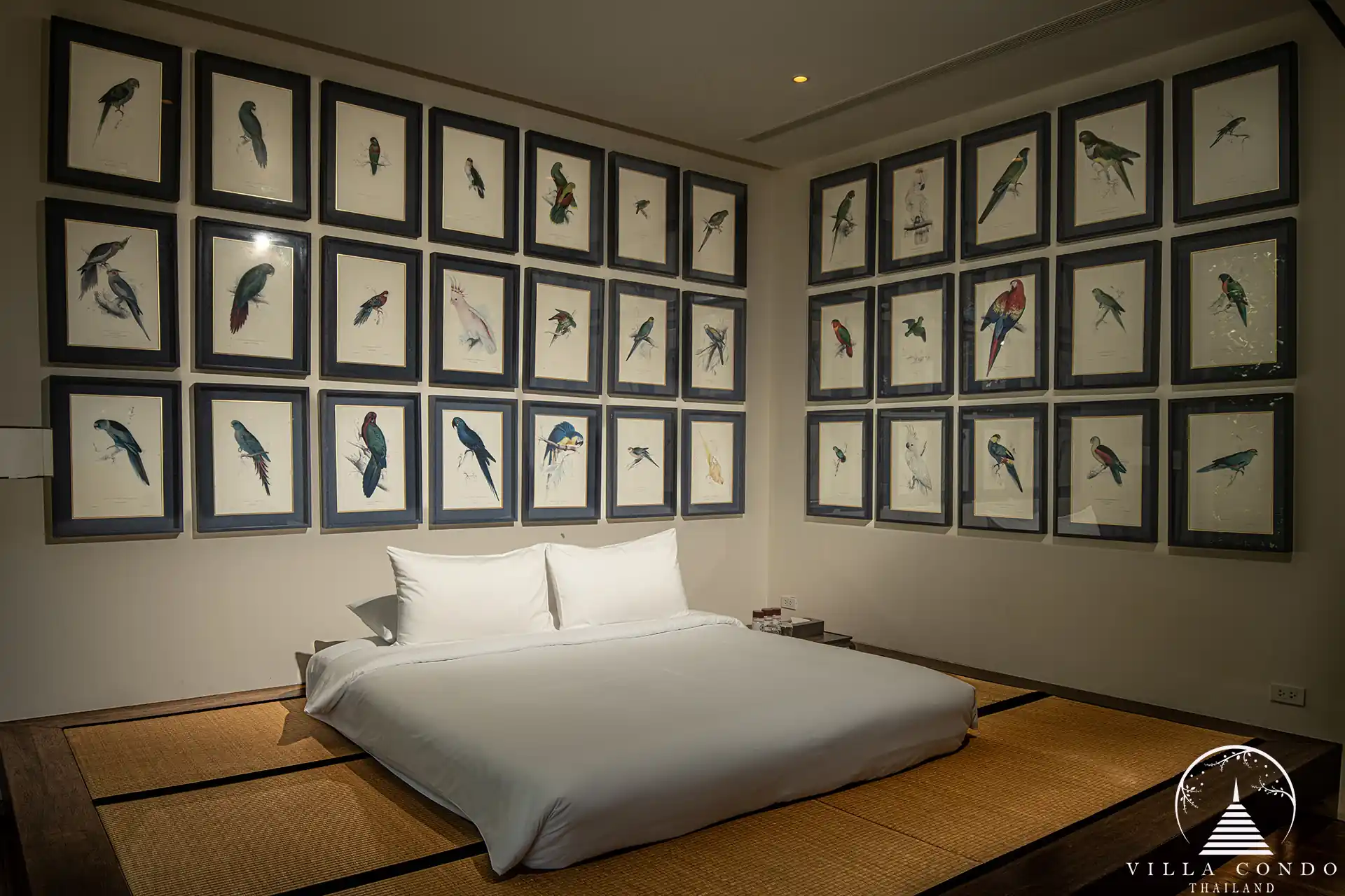 Luxurious bedroom in Villa Amarisa with wooden floors and a private balcony.