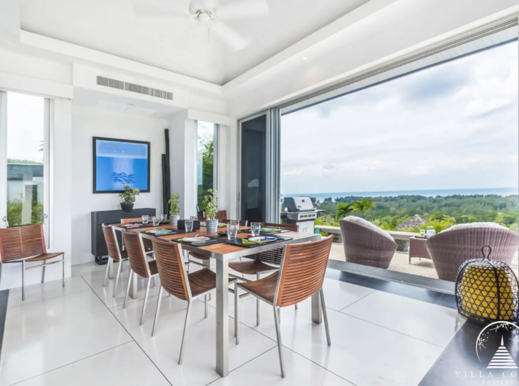 Elegant dining area at Villa Bauhinia with sea view