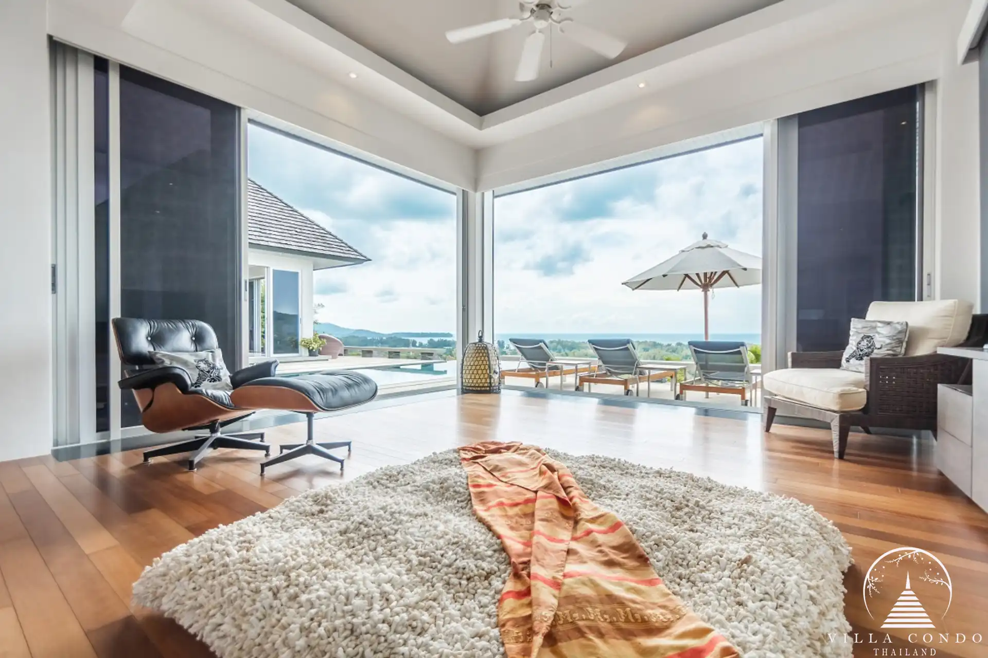 Master bedroom at Villa Bauhinia with private balcony and sea view