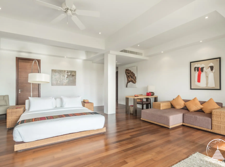 Master bedroom at Villa Bauhinia with private balcony and sea view