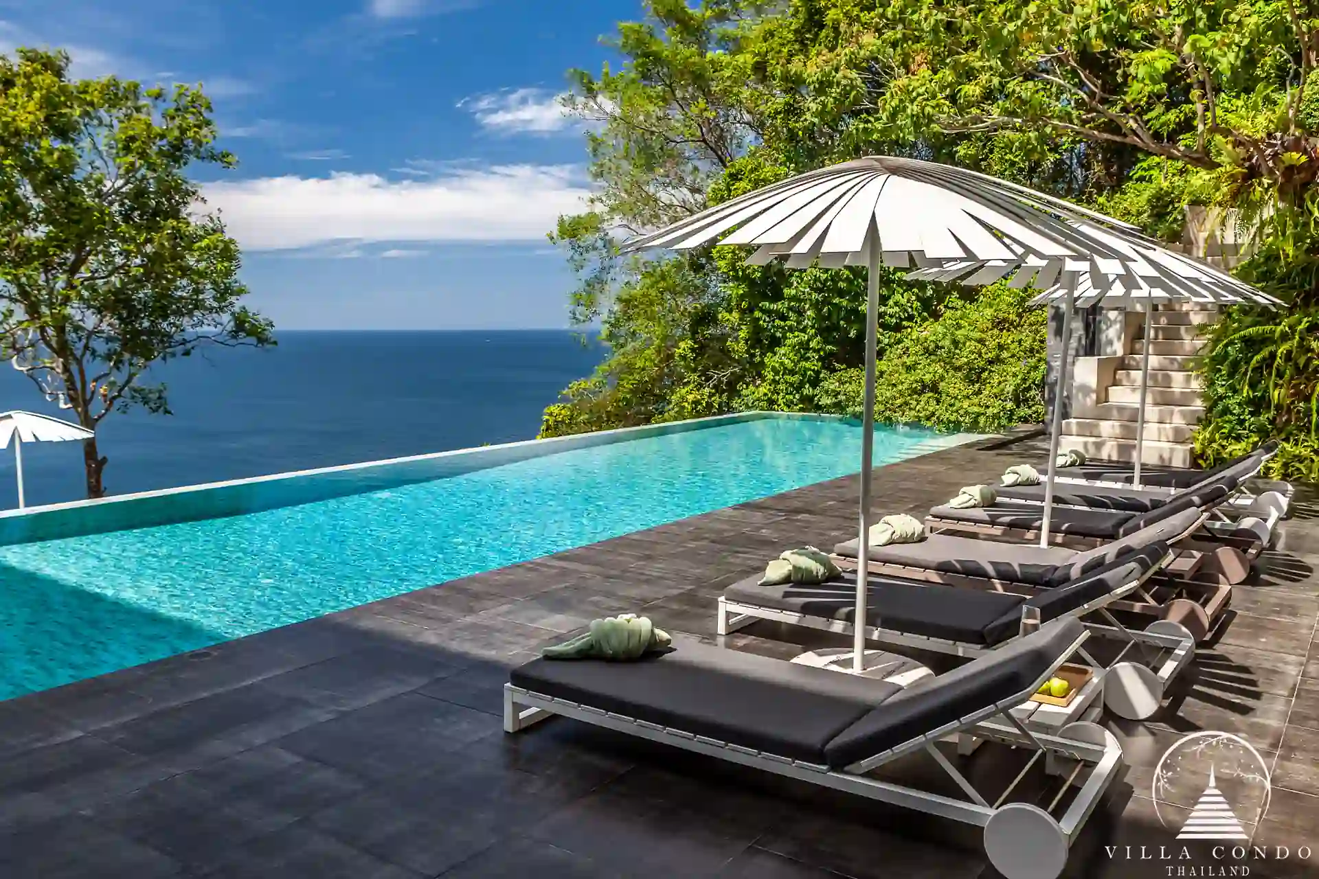 Private pool with sunbed at Villa Mayavee overlooking the sea
