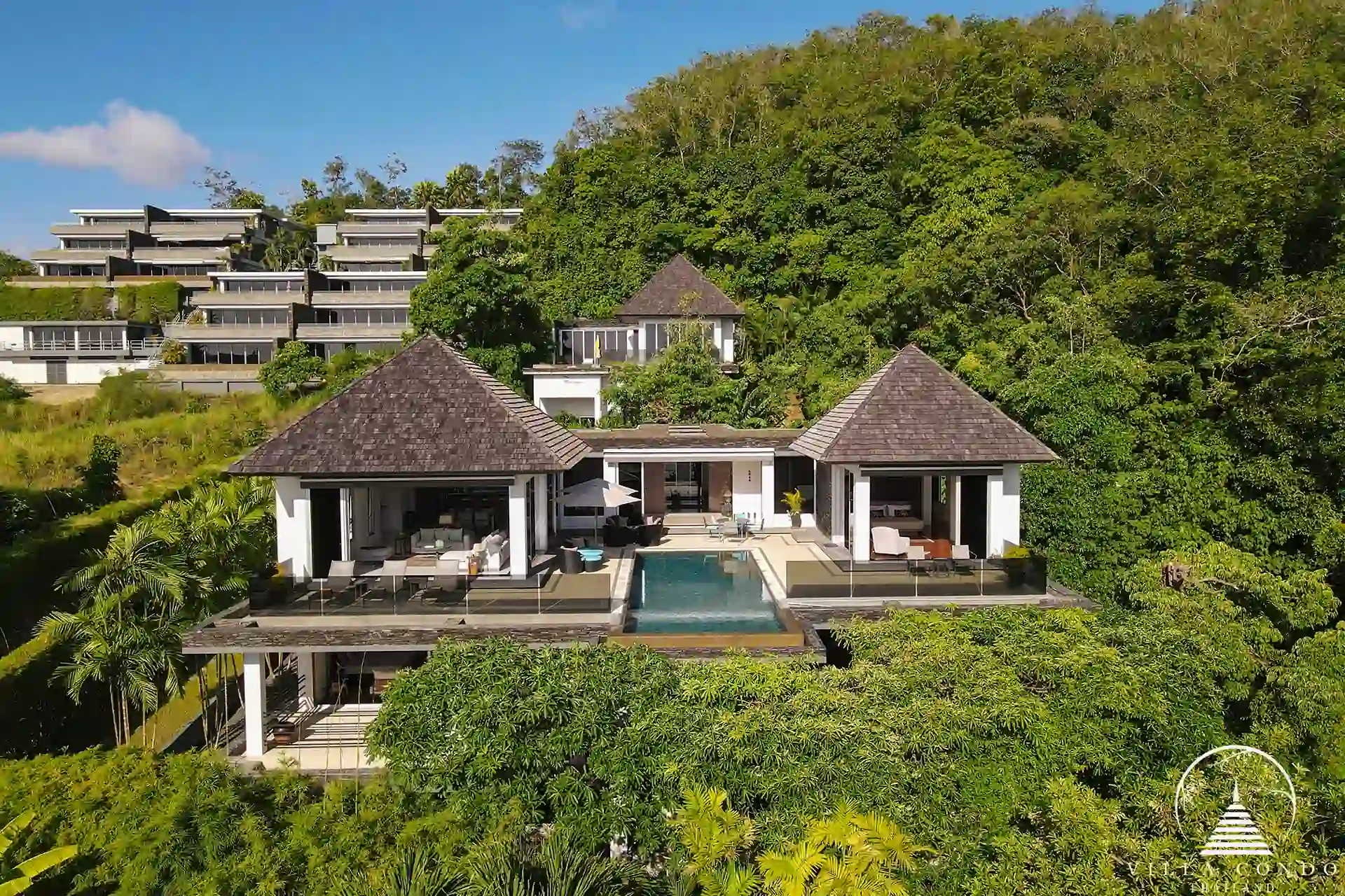 Back view of Villa Nova at Layan Hillside with a view of the terrace and pool area.
