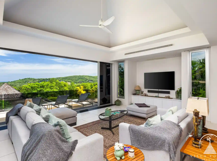 Spacious living area in Villa Nova at Layan Hillside with panoramic views and luxurious furnishings.