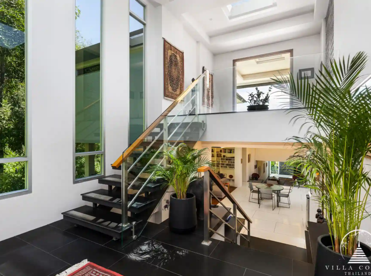 Luxurious interior of Villa Nova at Layan Hillside with elegant furnishings and open-plan design.