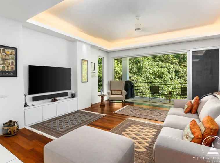 Cozy second living room at Villa Nova at Layan Hillside with modern decor and ocean views.
