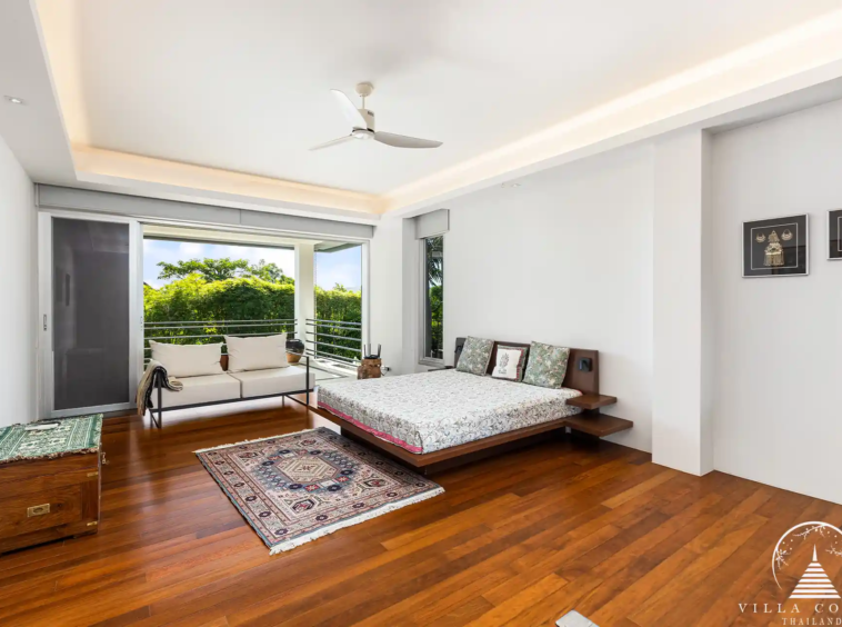 Spacious bedroom in Villa Nova at Layan Hillside with sea views and modern decor.