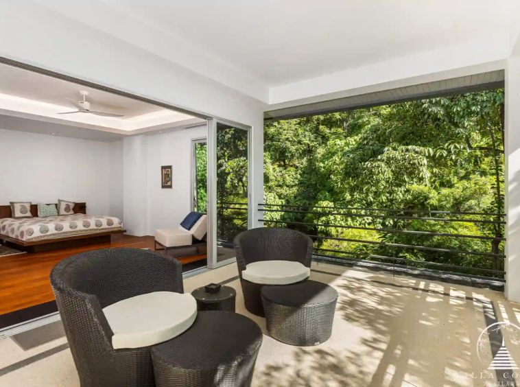 Roofed balcony at Villa Nova at Layan Hillside with ocean views and comfortable seating.