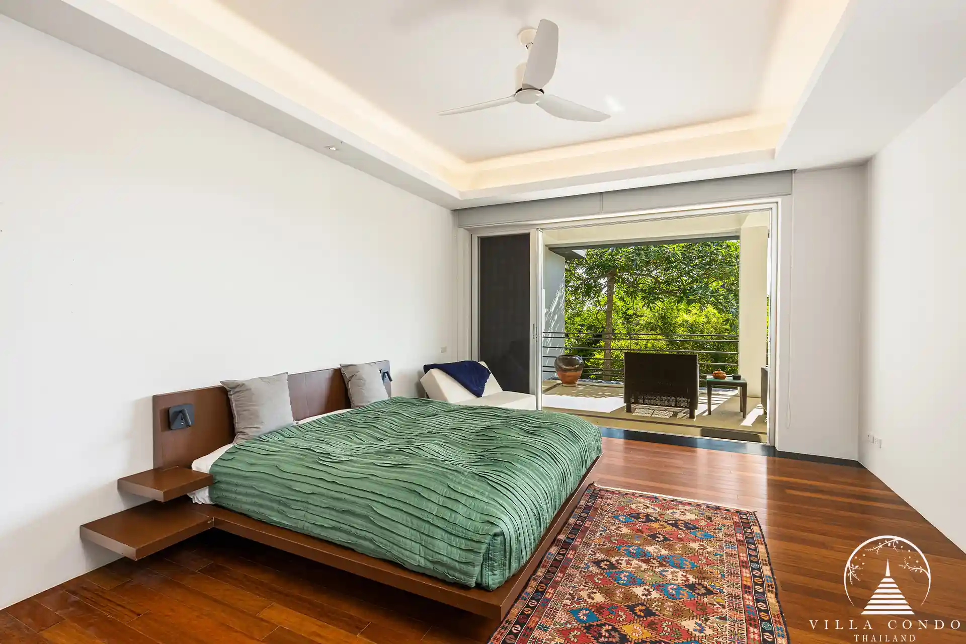Spacious bedroom in Villa Nova at Layan Hillside with sea views and modern decor.