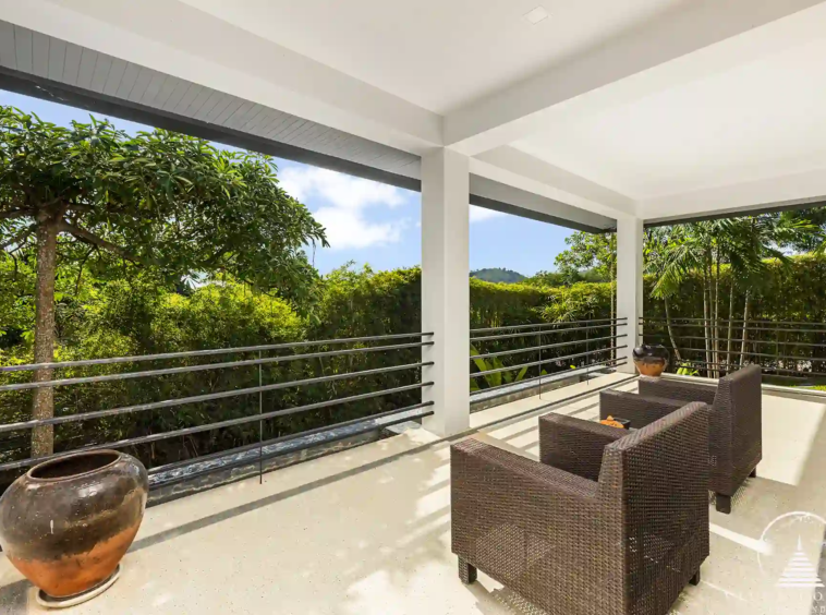 Roofed balcony at Villa Nova at Layan Hillside with ocean views and comfortable seating.