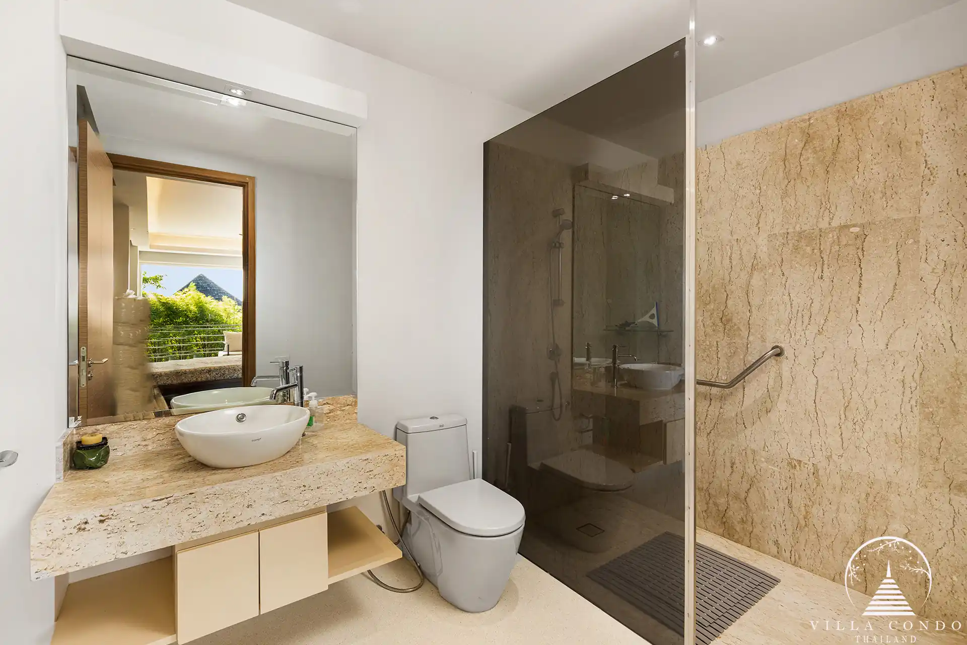 Modern bathroom in Villa Nova at Layan Hillside with natural stone accents and luxury fixtures.