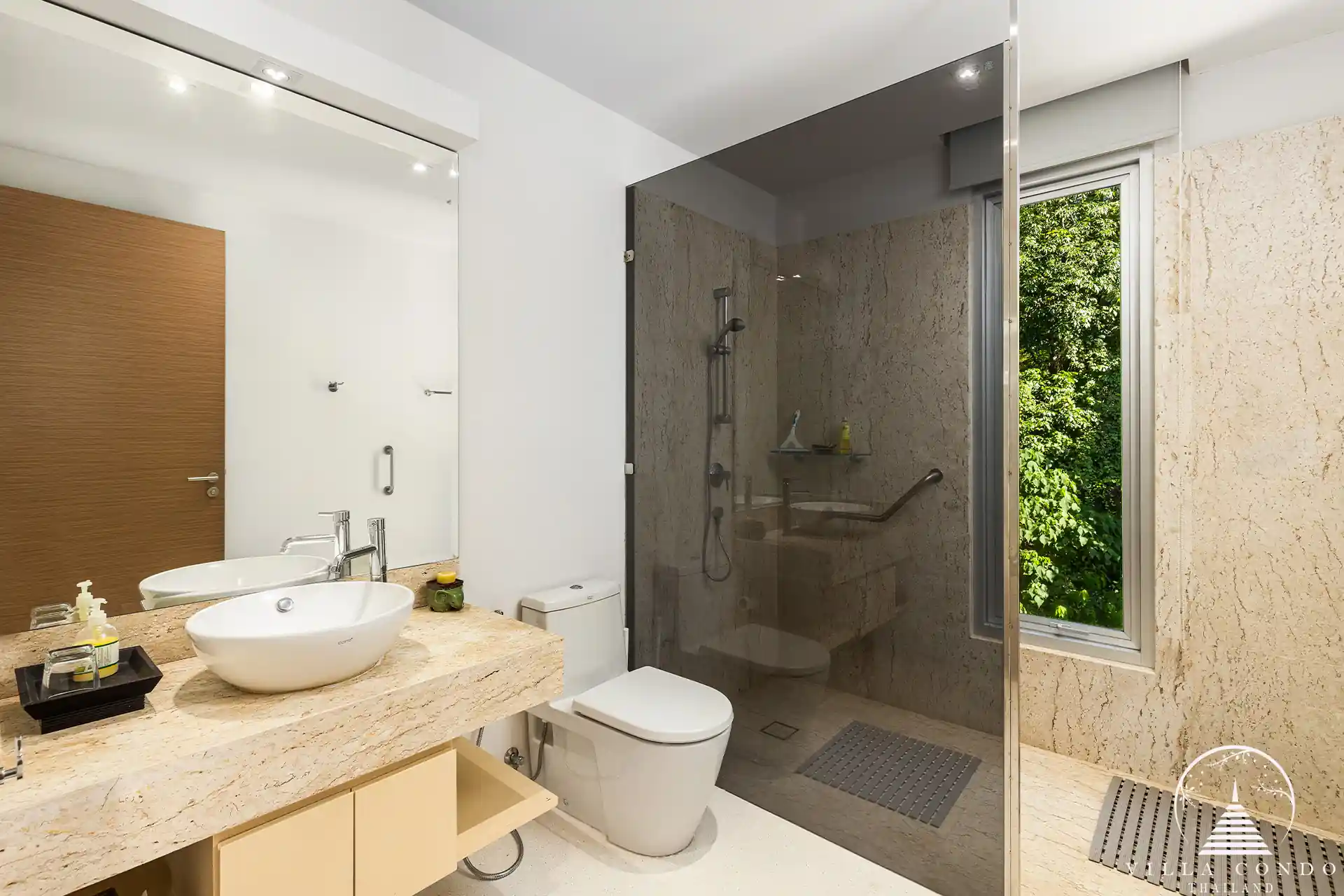 Modern bathroom in Villa Nova at Layan Hillside with natural stone accents and luxury fixtures.