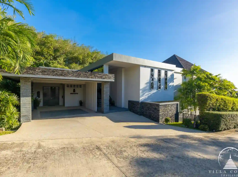 Elegant entrance of Villa Nova at Layan Hillside with natural stone and wood features.