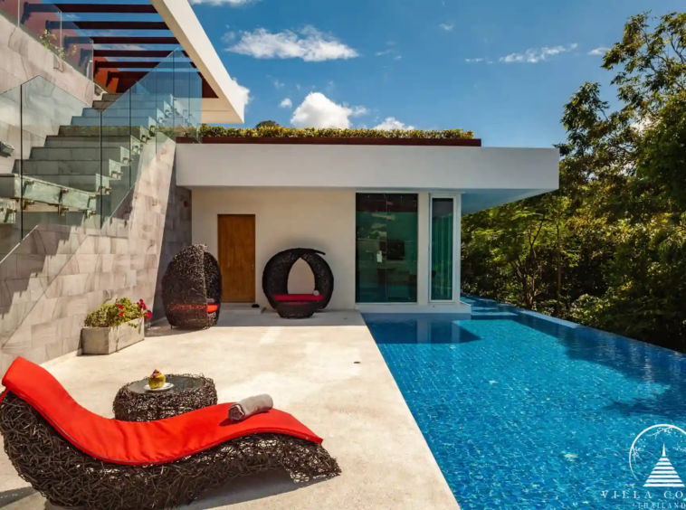 Outdoor area with a private pool and seating at Villa Solaris Kamala.
