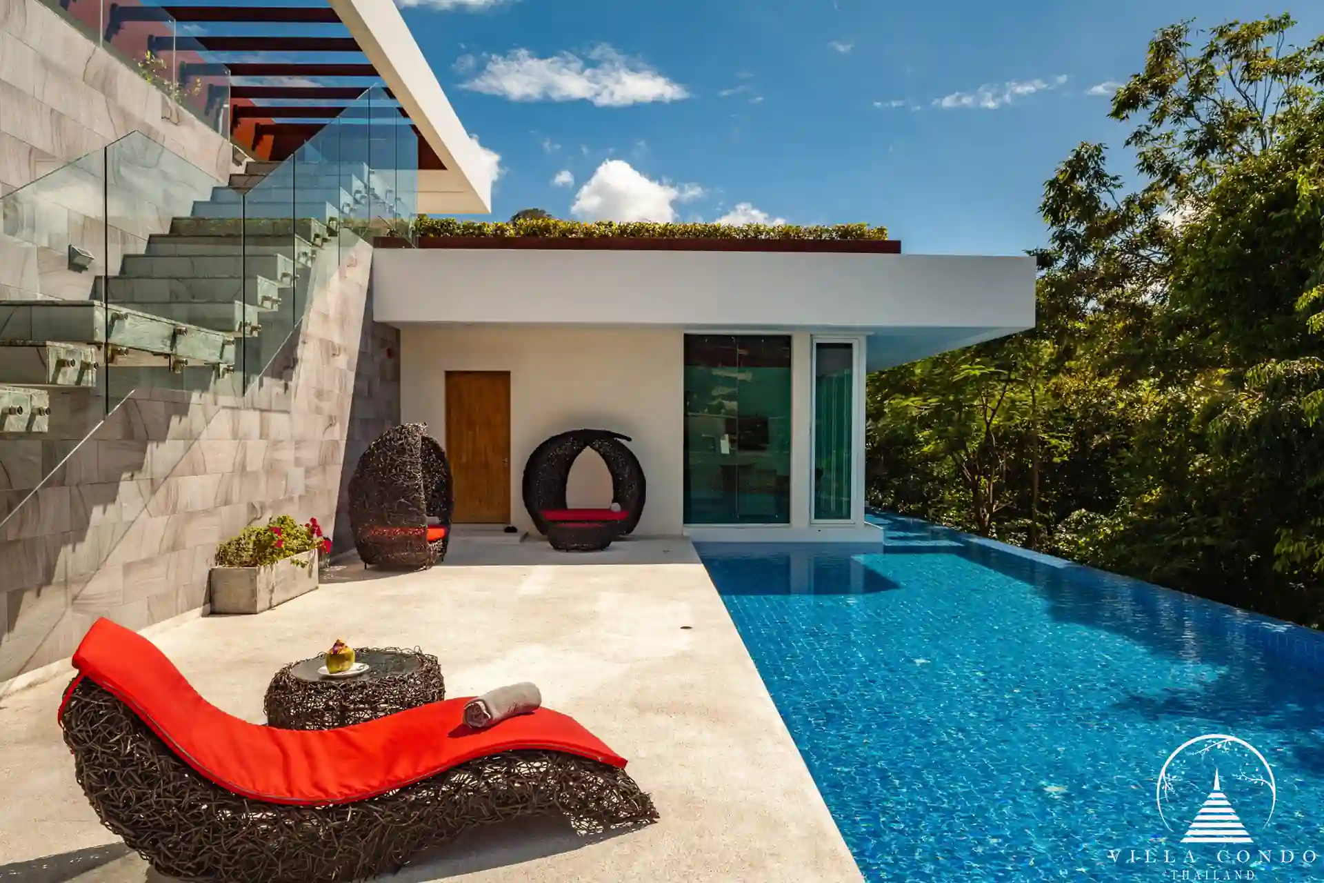 Outdoor area with a private pool and seating at Villa Solaris Kamala.