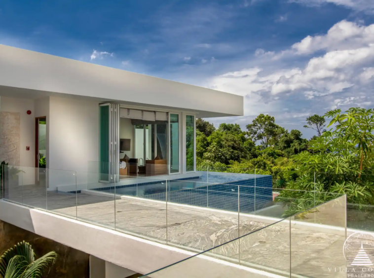 Outdoor area with a private pool and seating at Villa Solaris Kamala.