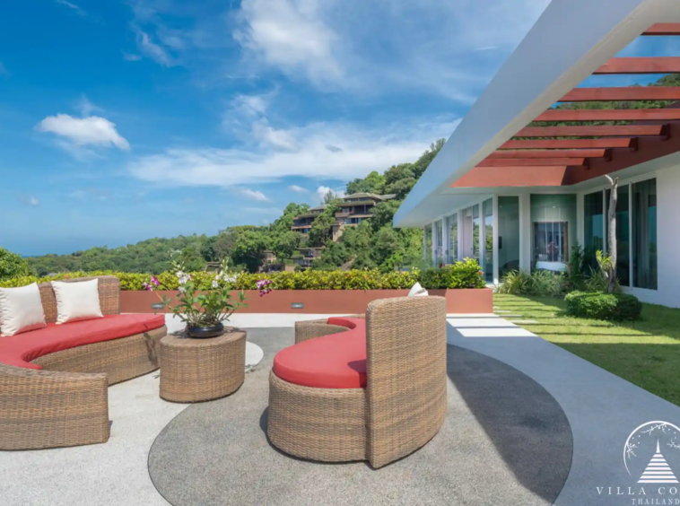 Outdoor sofa area with ocean views at Villa Solaris Kamala.