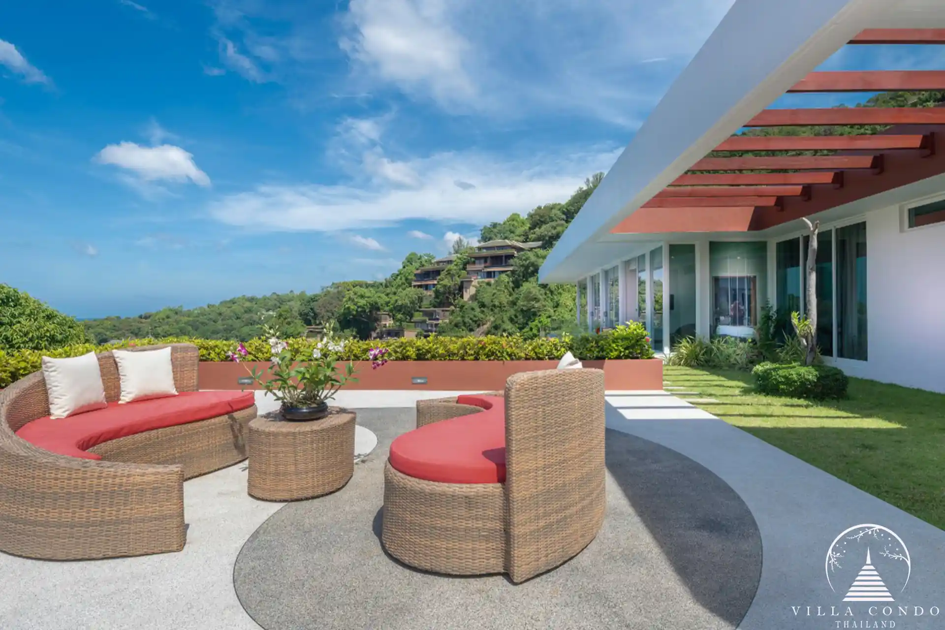 Outdoor sofa area with ocean views at Villa Solaris Kamala.