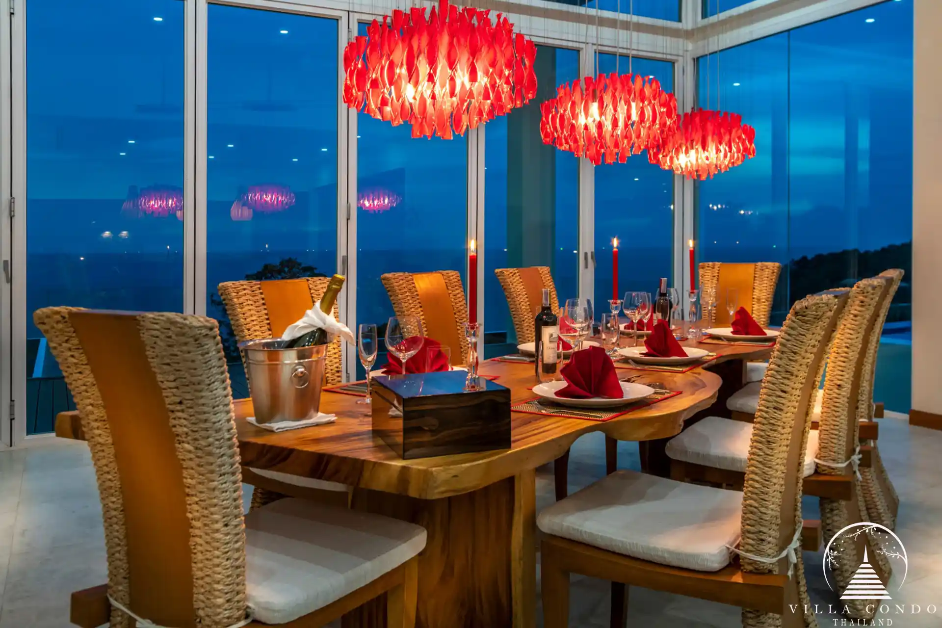 Elegant dining area with modern furnishings and ocean views at Villa Solaris Kamala.