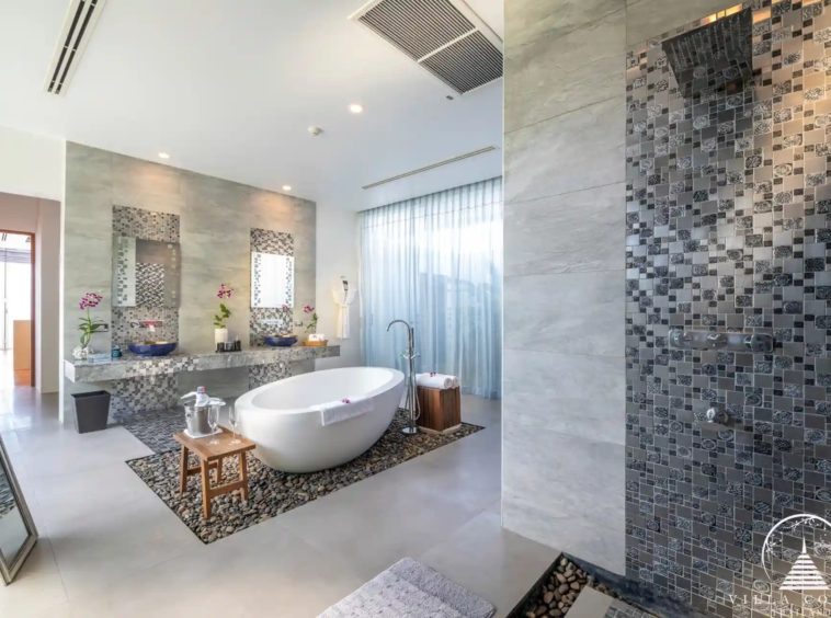 Elegant master bathroom with ocean views in Villa Solaris Kamala.