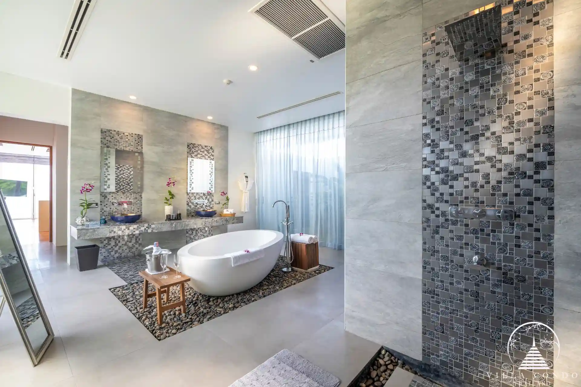 Elegant master bathroom with ocean views in Villa Solaris Kamala.