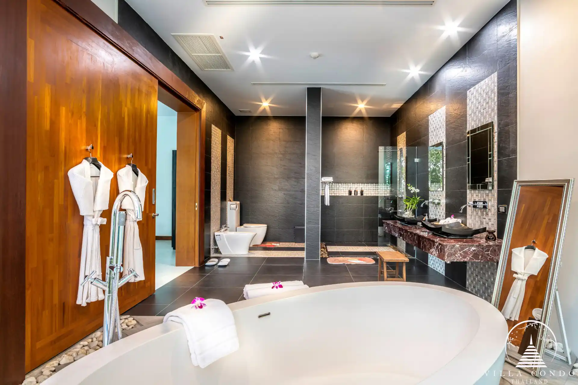 Elegant master bathroom with ocean views in Villa Solaris Kamala.