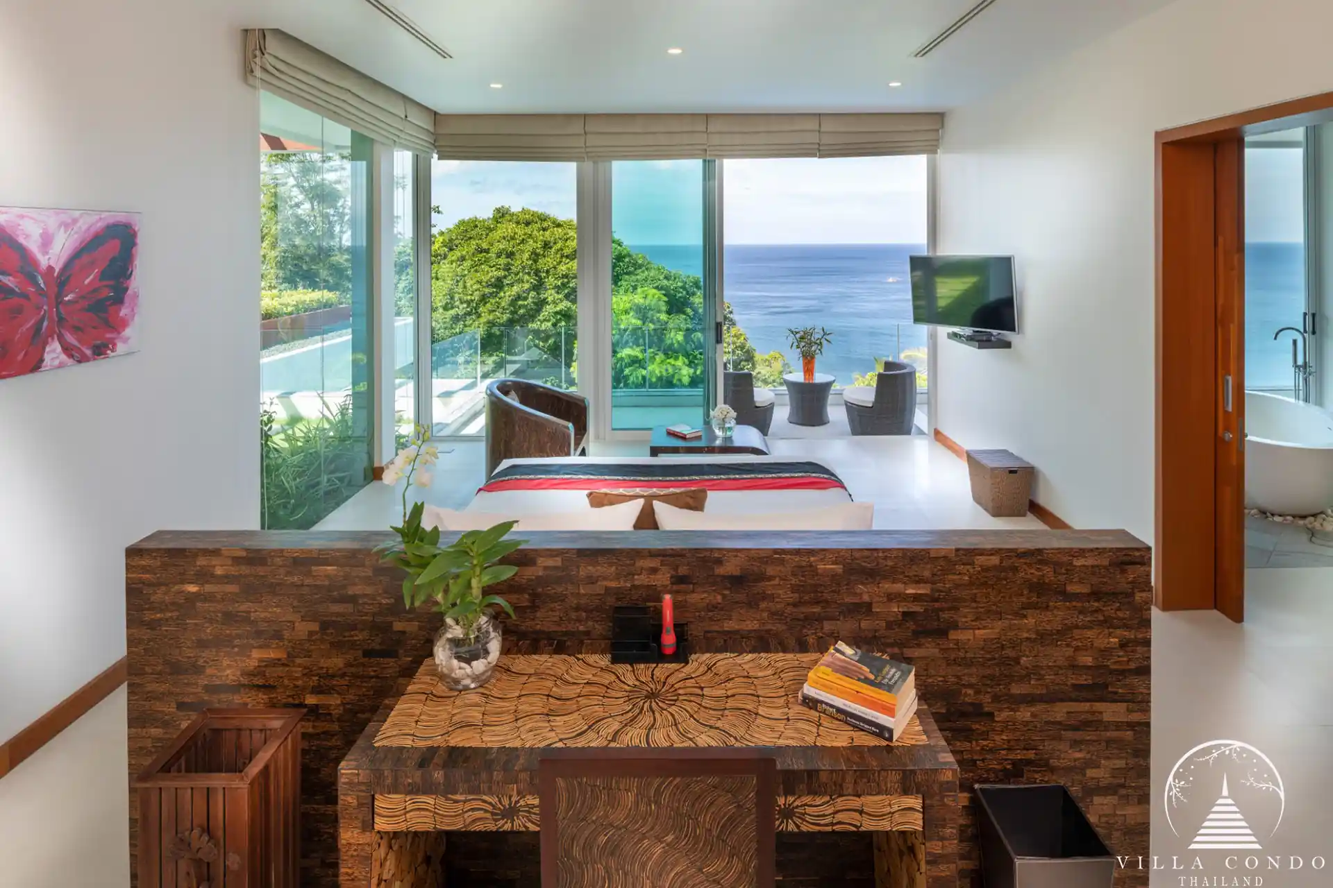 Master bedroom with private pool and sea views at Villa Solaris Kamala.