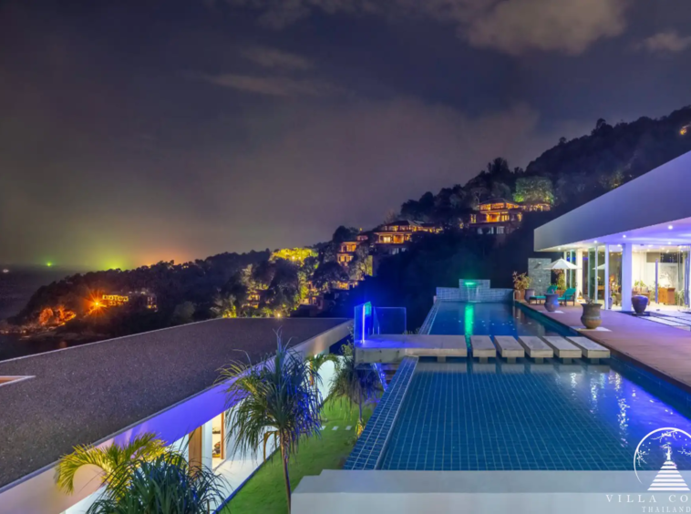 Night view of Villa Solaris Kamala exterior, beautifully lit.