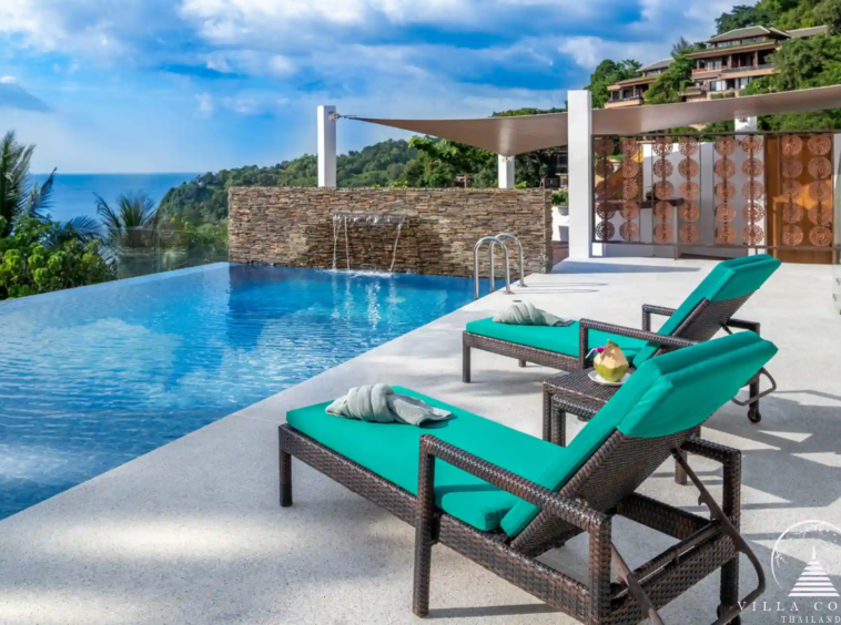 Private pool with sunbeds and sea view at Villa Solaris Kamala.