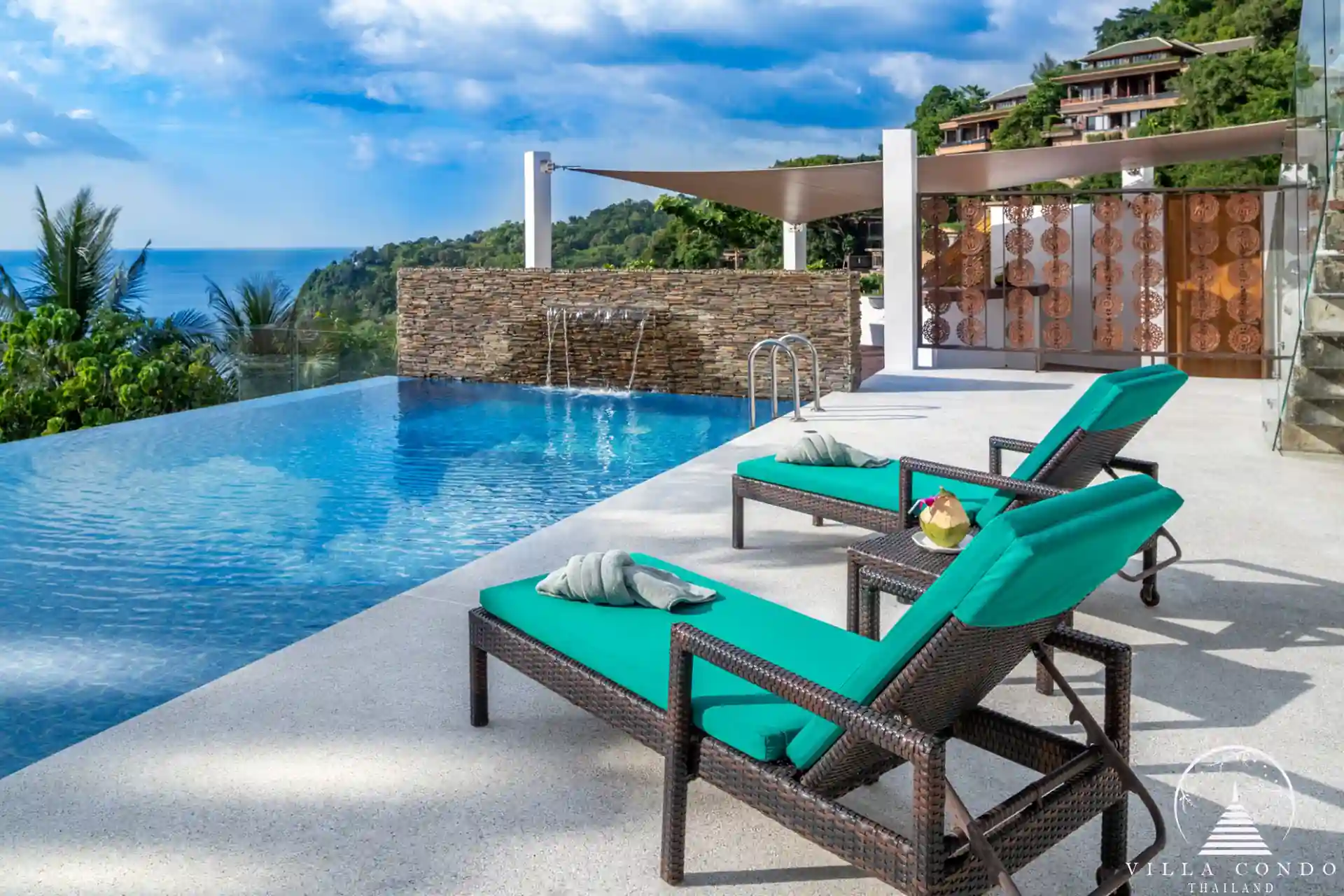 Private pool with sunbeds and sea view at Villa Solaris Kamala.