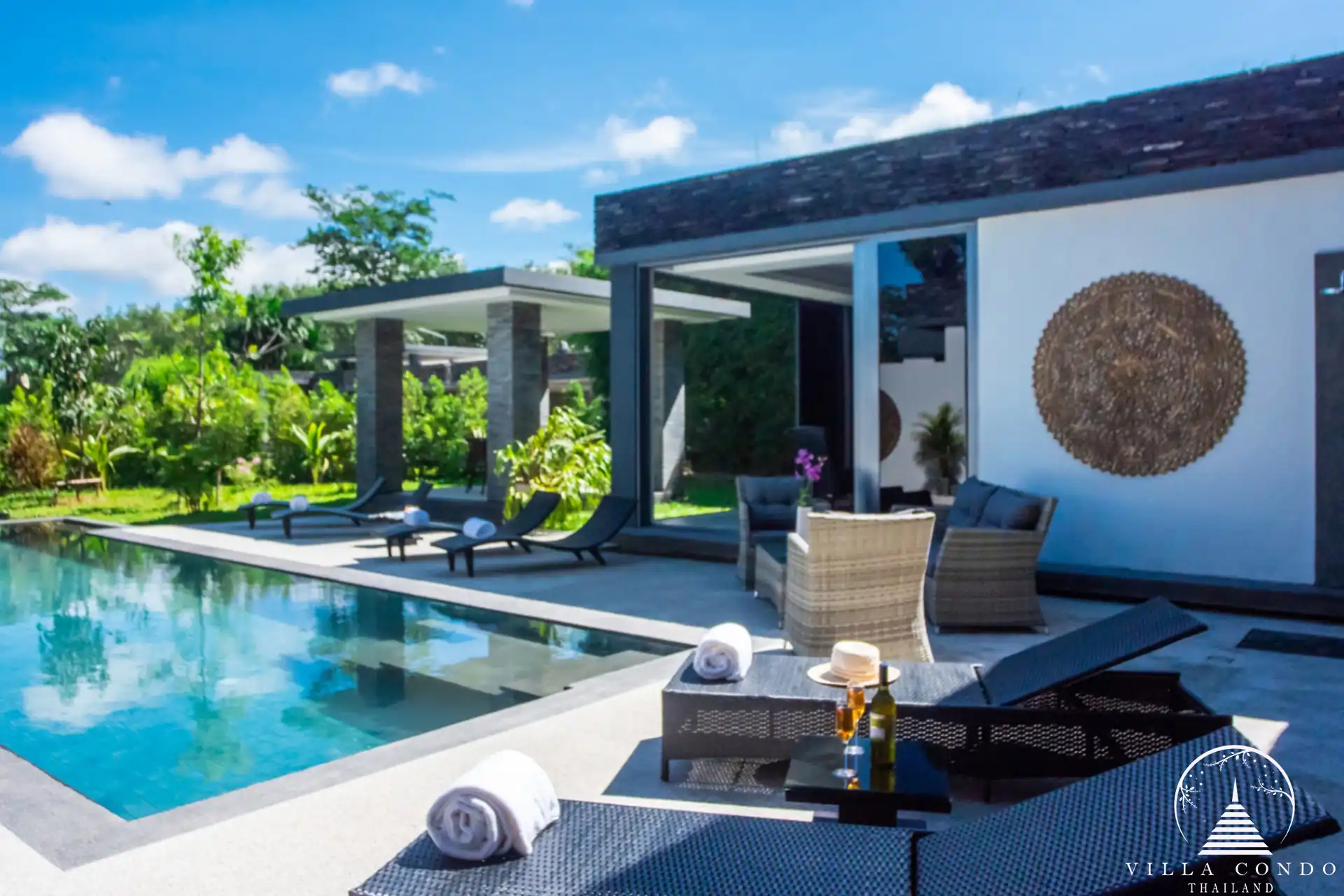 Outdoor area with tropical gardens at Villas by the Big Bamboo.