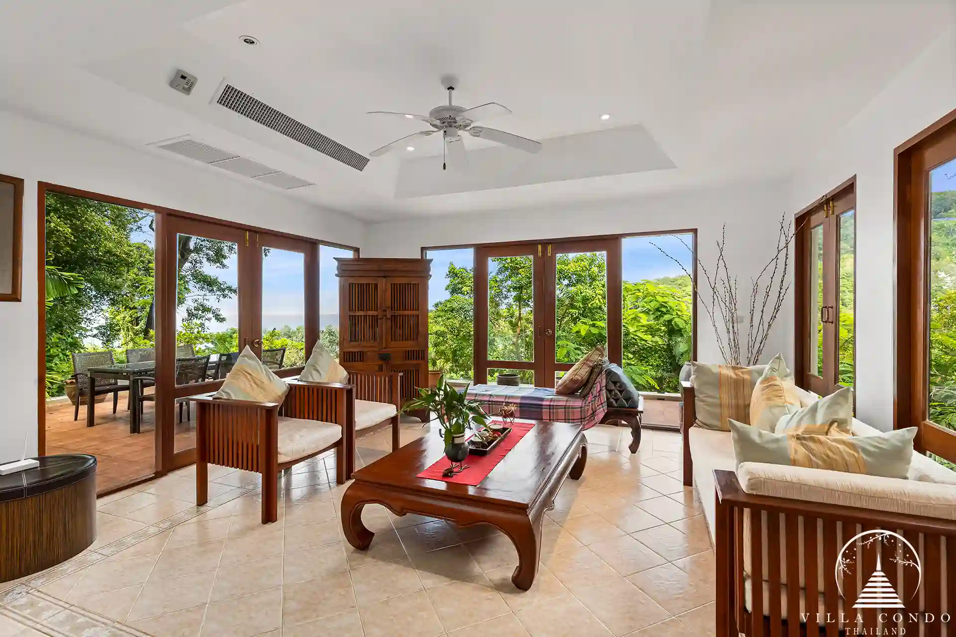 Spacious living area at Nakathani Villa Estate Kamala Beach with high ceilings and ocean views.