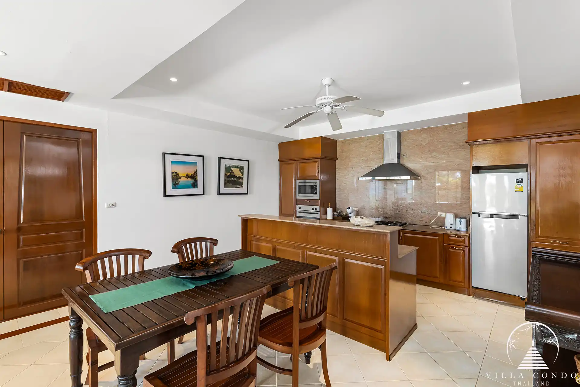 Dining area in Nakathani Villa Estate Kamala Beach showcasing elegant table setup.