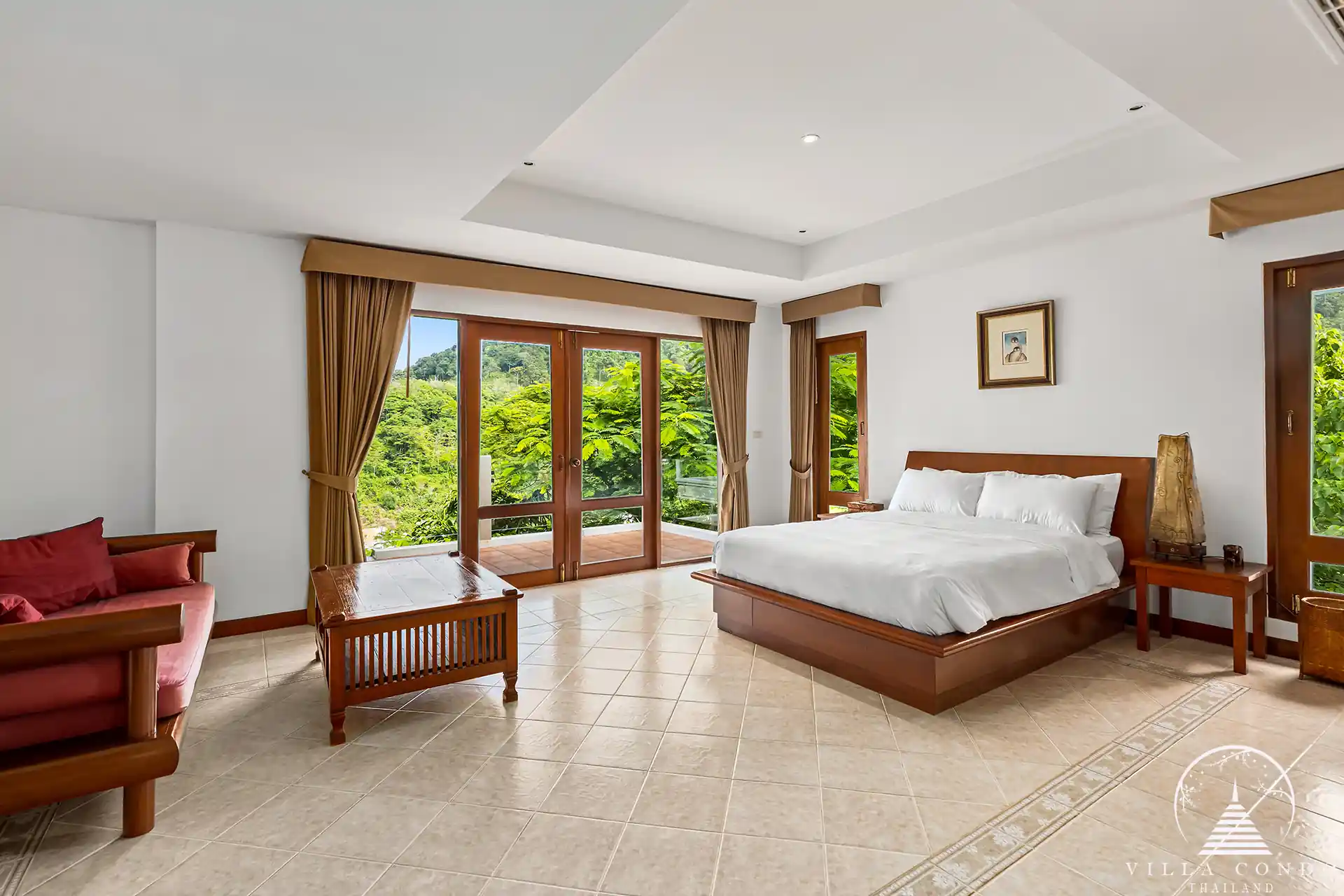 Elegant guest bedroom at Nakathani Villa Estate Kamala Beach with ocean views and luxurious decor.