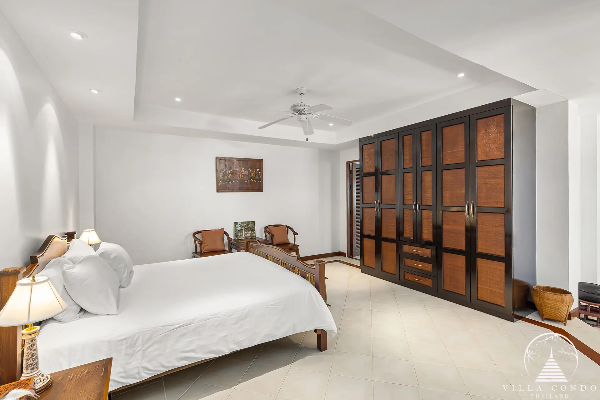 Luxurious master bedroom with ocean views at Nakathani Villa Estate Kamala Beach.