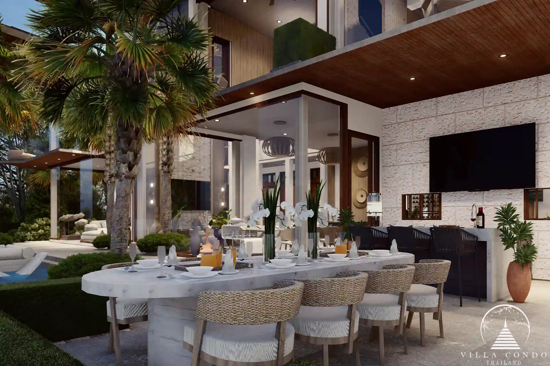 Outdoor dining area at Narana Villa Phuket, featuring a modern table with lush garden views.