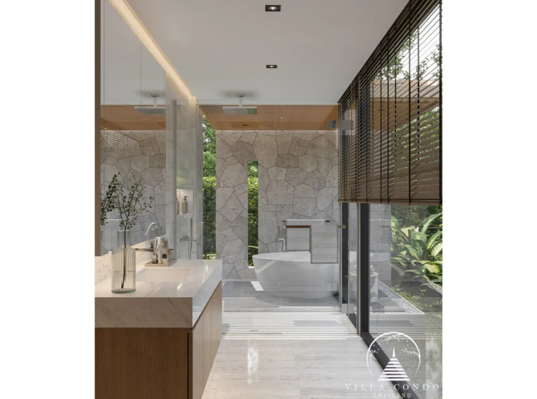 Luxurious master bathroom with outdoor bathtub at The Baya Villas.