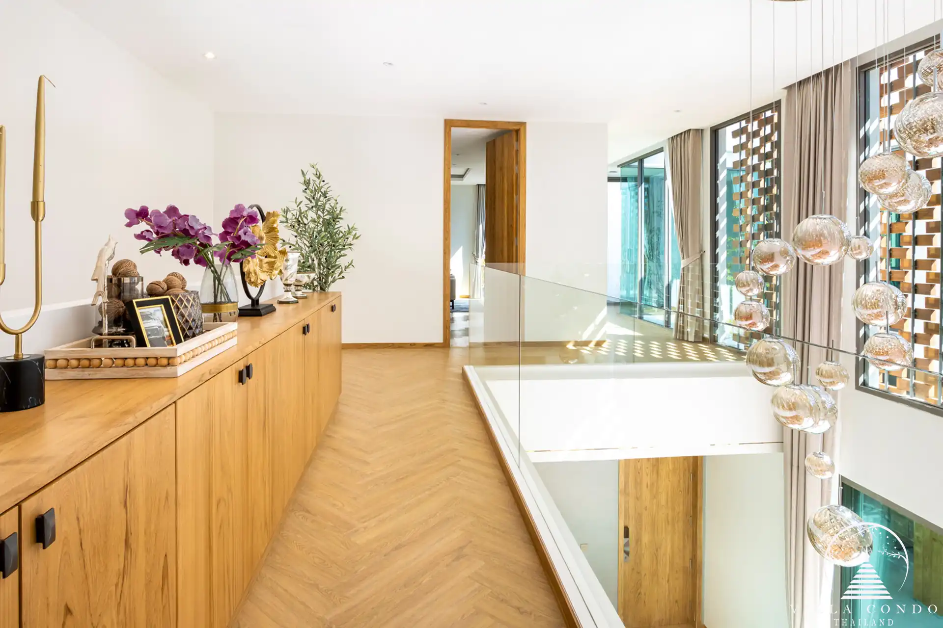 The Teak Phuket villa's luxurious interior with high ceilings and modern design