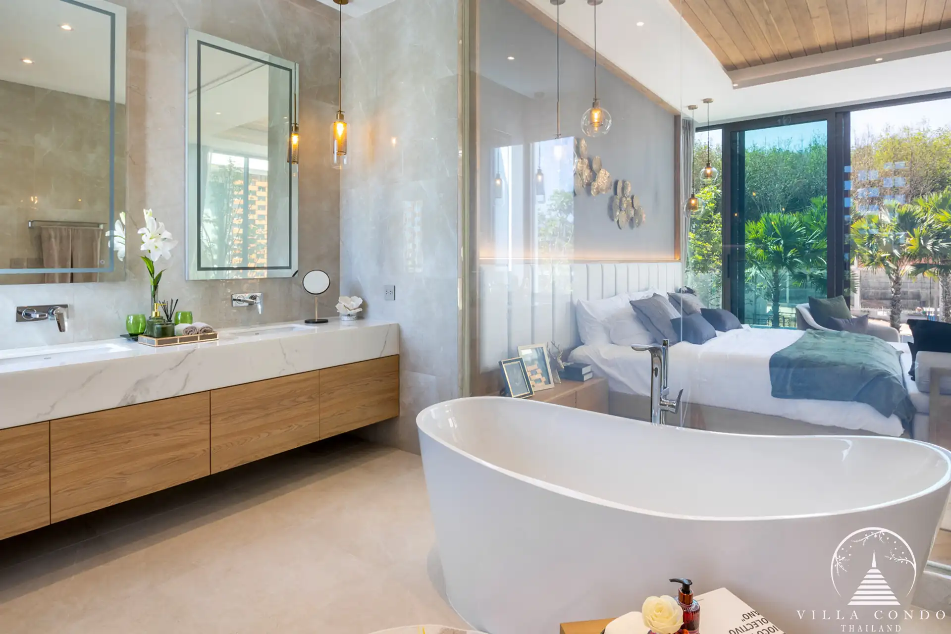 Luxurious master bathroom with marble countertops and bathtub at The Teak Phuket
