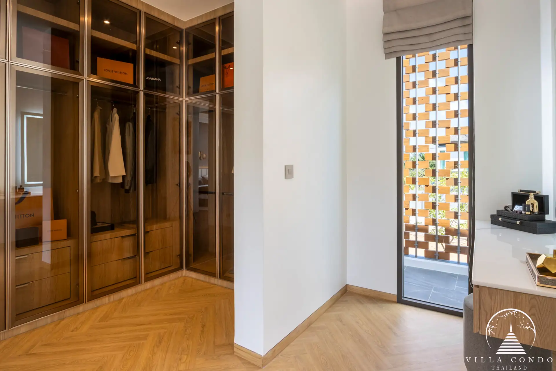 Stylish walk-in closet with ample storage at The Teak Phuket