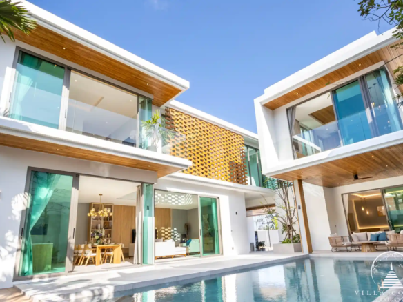 The Teak Phuket luxury villa exterior with teakwood façade and lush tropical surroundings