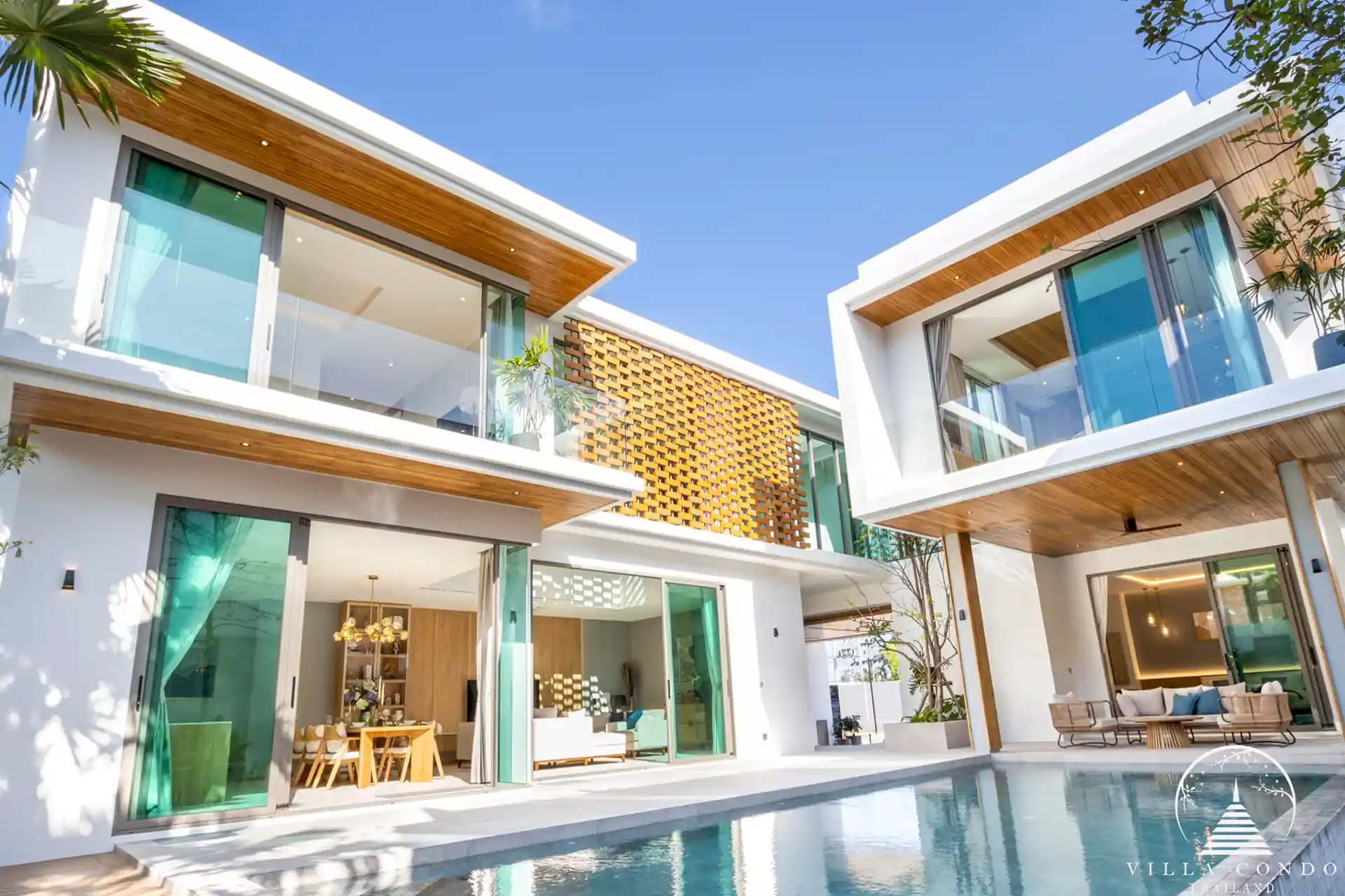 The Teak Phuket luxury villa exterior with teakwood façade and lush tropical surroundings