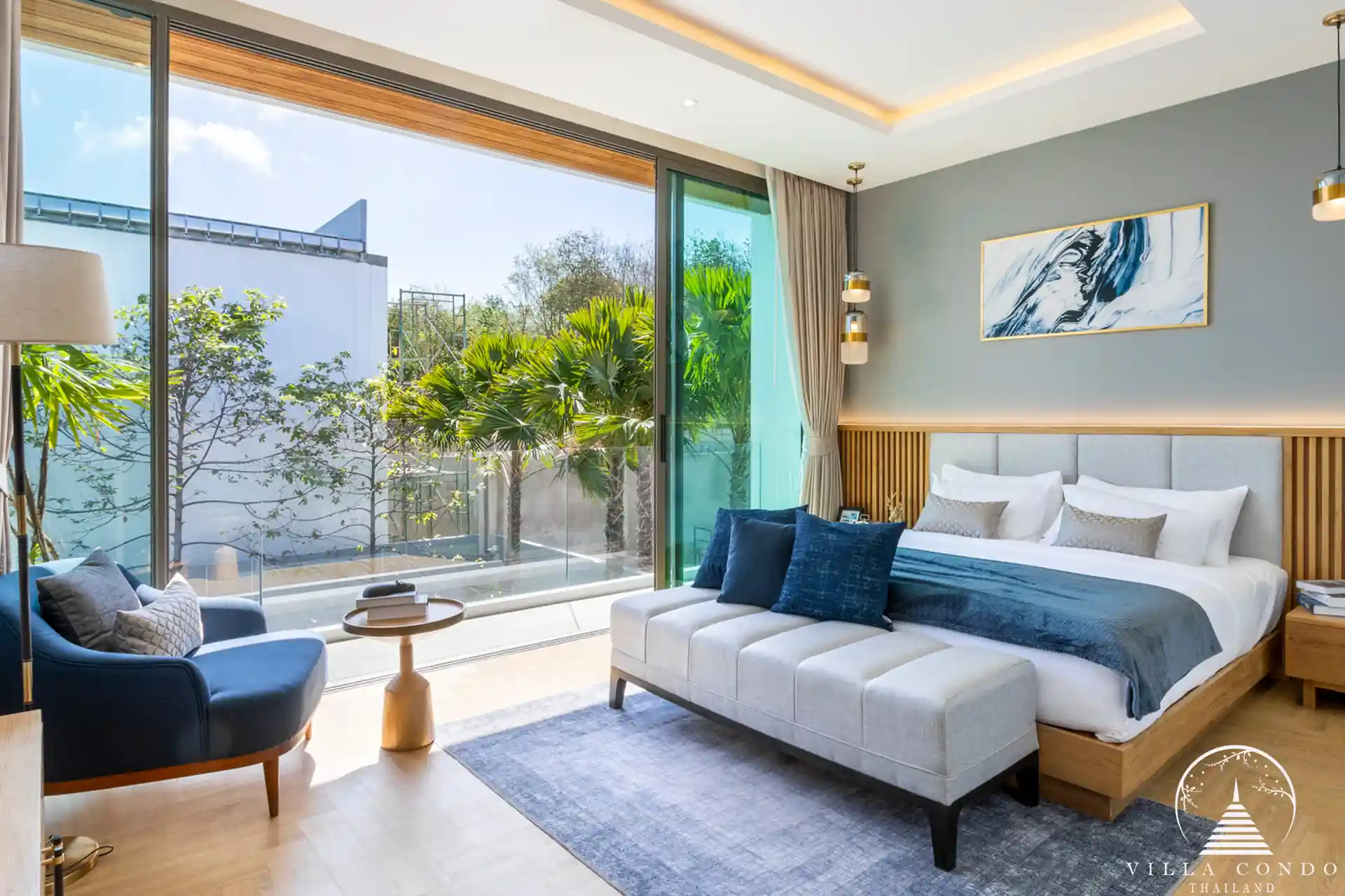 Cozy bedroom in The Teak Phuket with modern furnishings and natural lighting