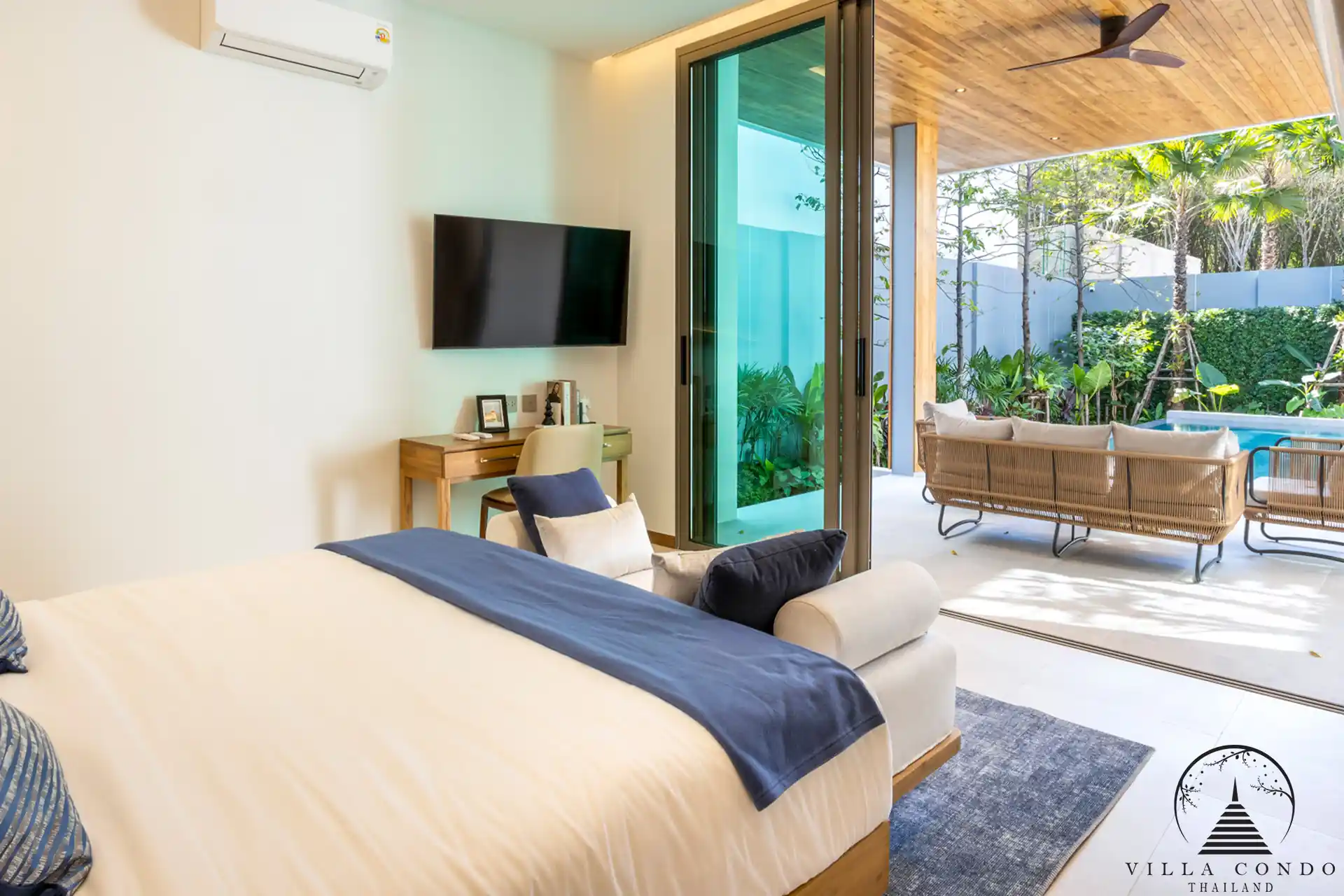 Spacious master bedroom with modern furnishings at The Teak Phuket