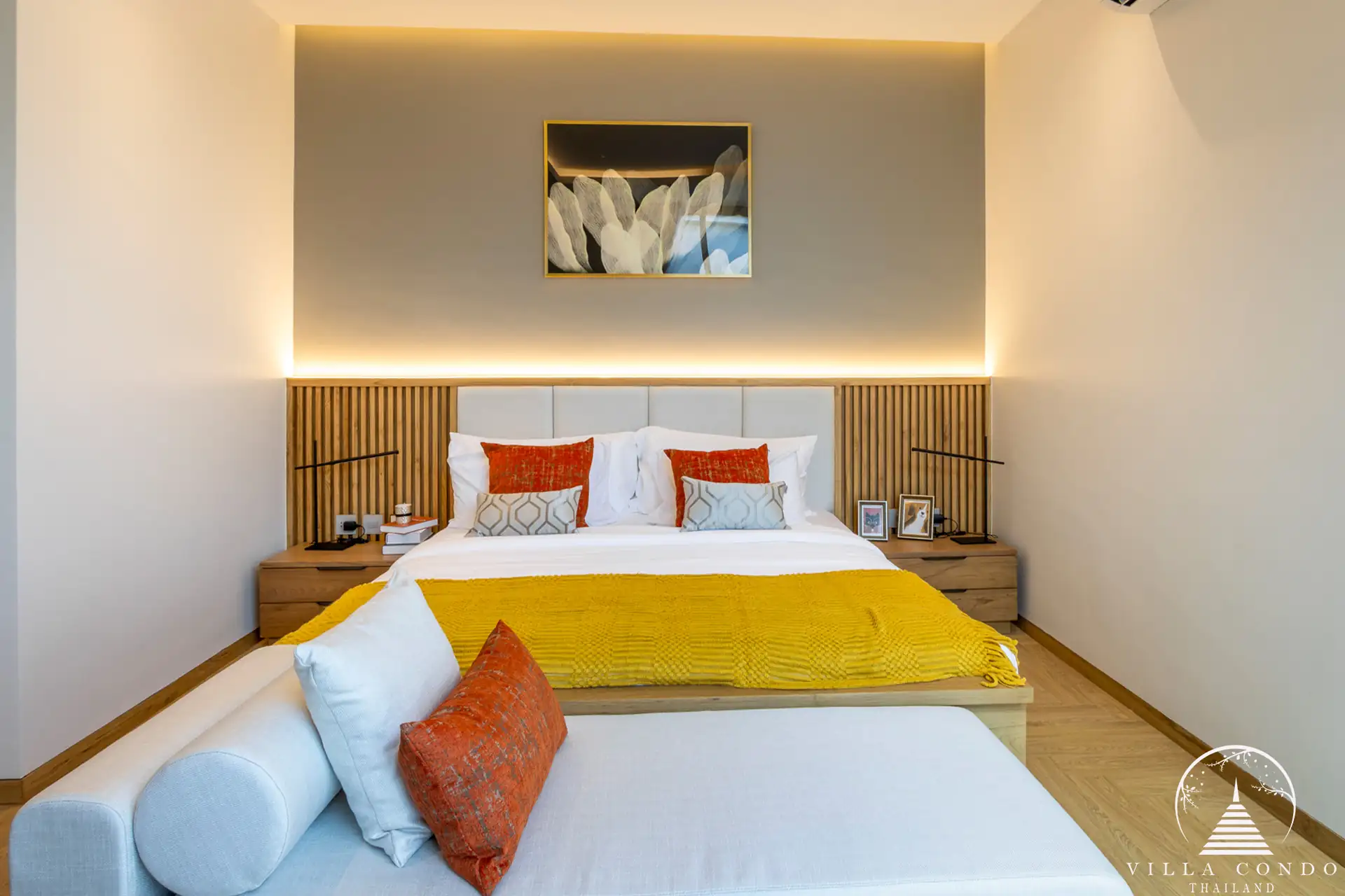 Cozy bedroom in The Teak Phuket with modern furnishings and natural lighting