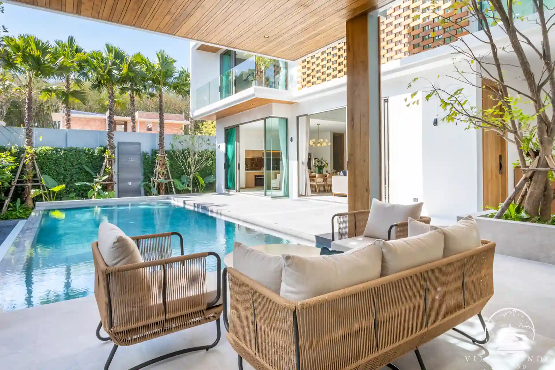 Outdoor living area with comfortable seating at The Teak Phuket
