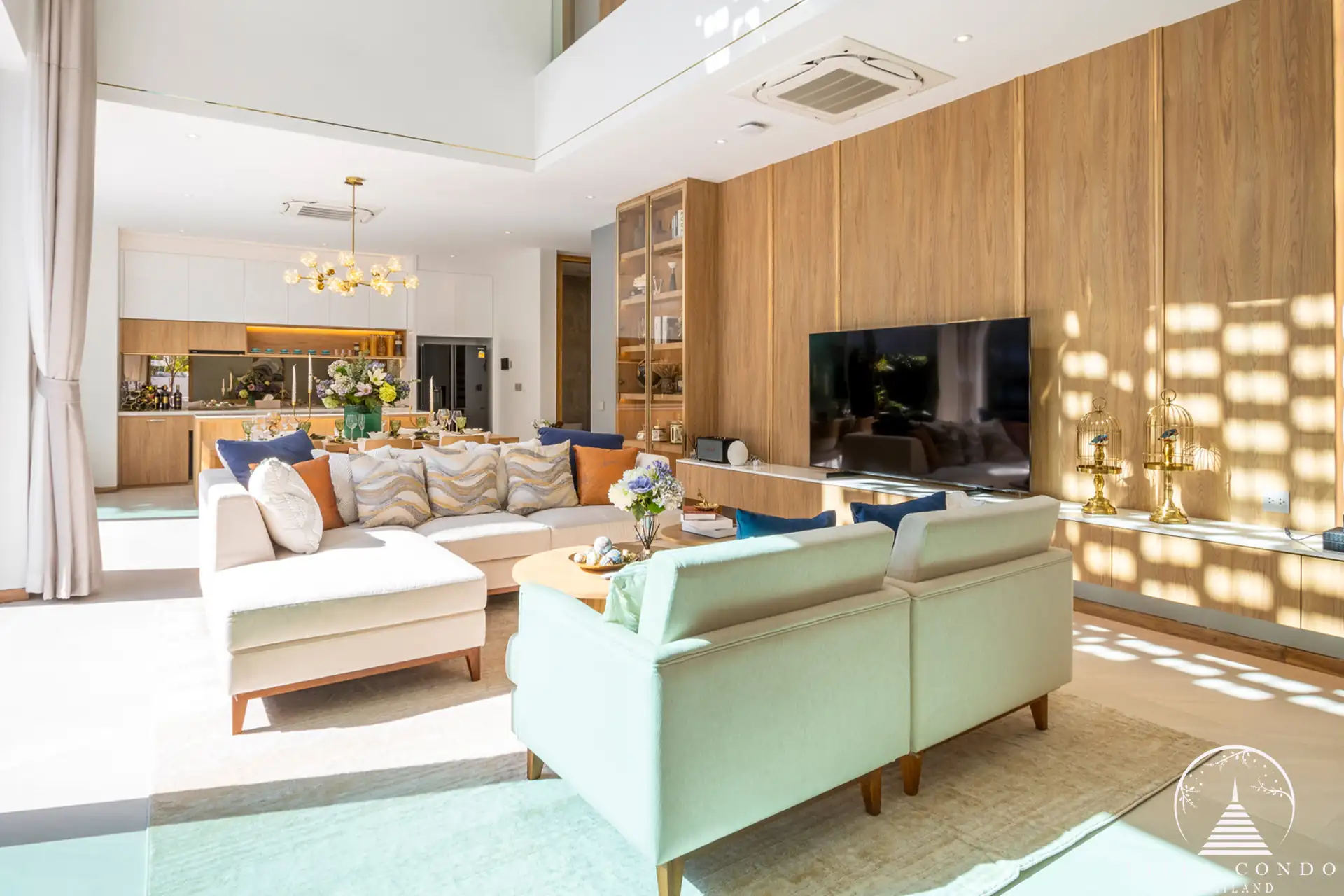 Spacious living area with high ceilings at The Teak Phuket