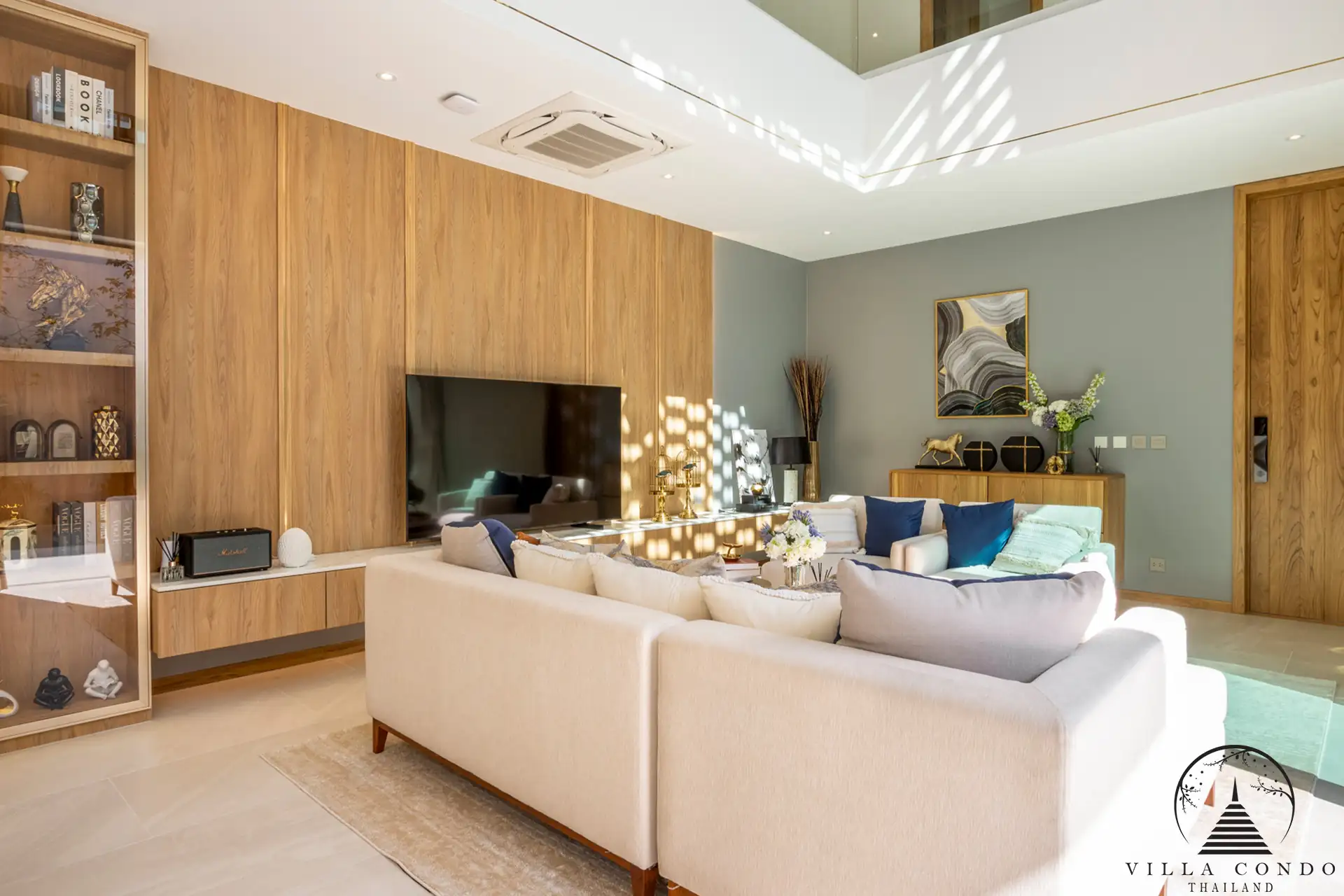 Spacious living area with high ceilings at The Teak Phuket