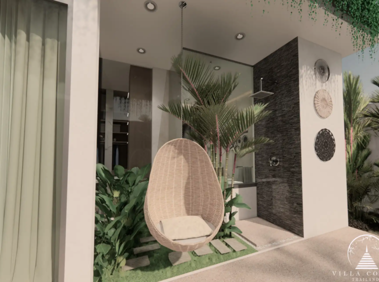 Outdoor area at Unique Villa Kata with a hanging sofa and garden view.